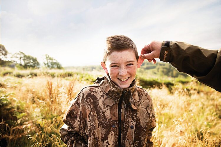 Boy having his ear pulled