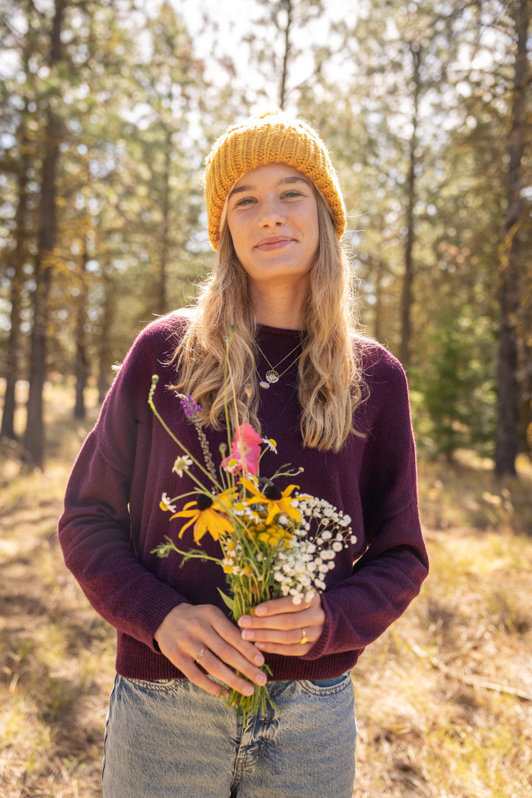 Teen Girl with Wildflowers in Forest